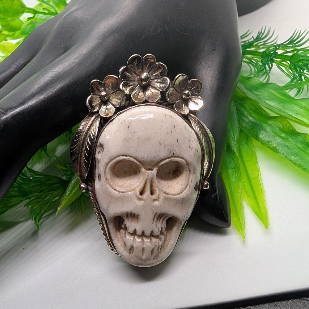 Detailed bone carved skull ring with flower crown